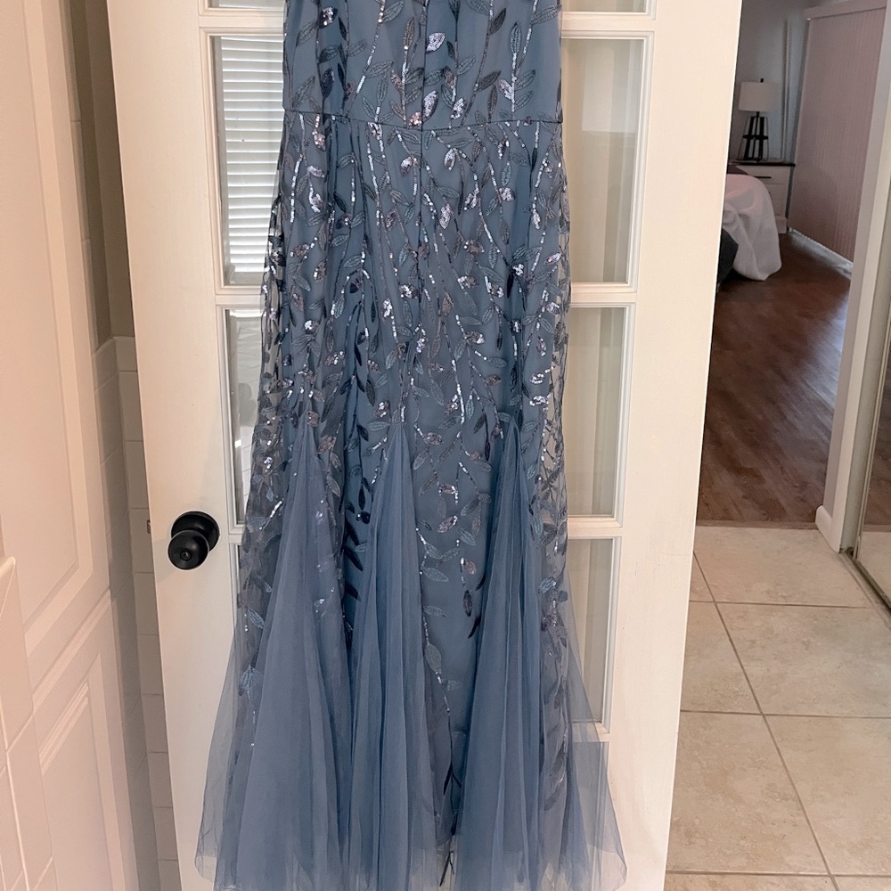 Brand new with tags.  Decided on a different dress.  My loss your gain.
